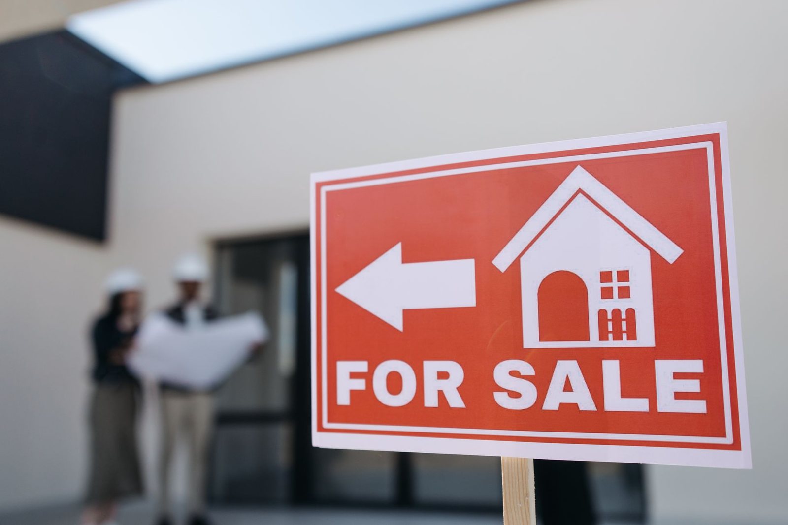 A commercial real estate "for sale" sign.