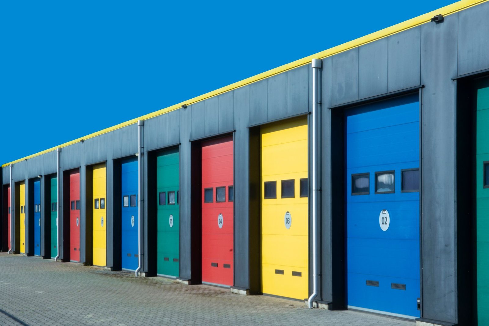 A self-storage facility with rows of drive-up storage units.